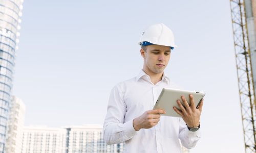 medium-shot-young-man-with-helmet-tablet
